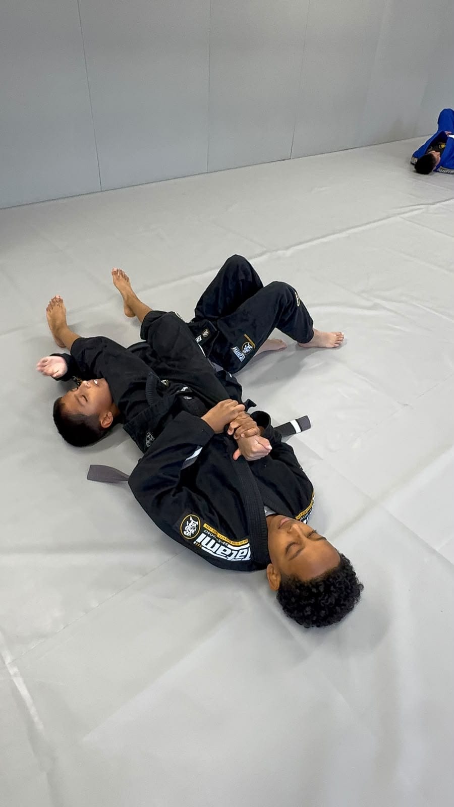 Kids BJJ students listening to their coach